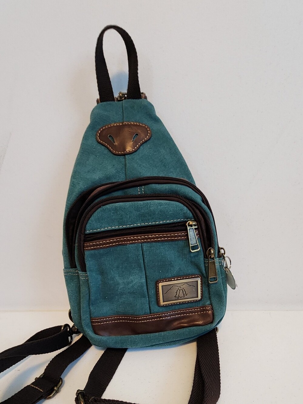 Canvas Sling Backpack in Teal with Brown Trim